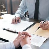 Trial attorneys going over a wrongful death case.