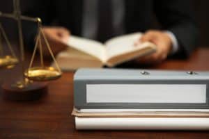 A Dothan dog bite lawyer working on a case at his desk.