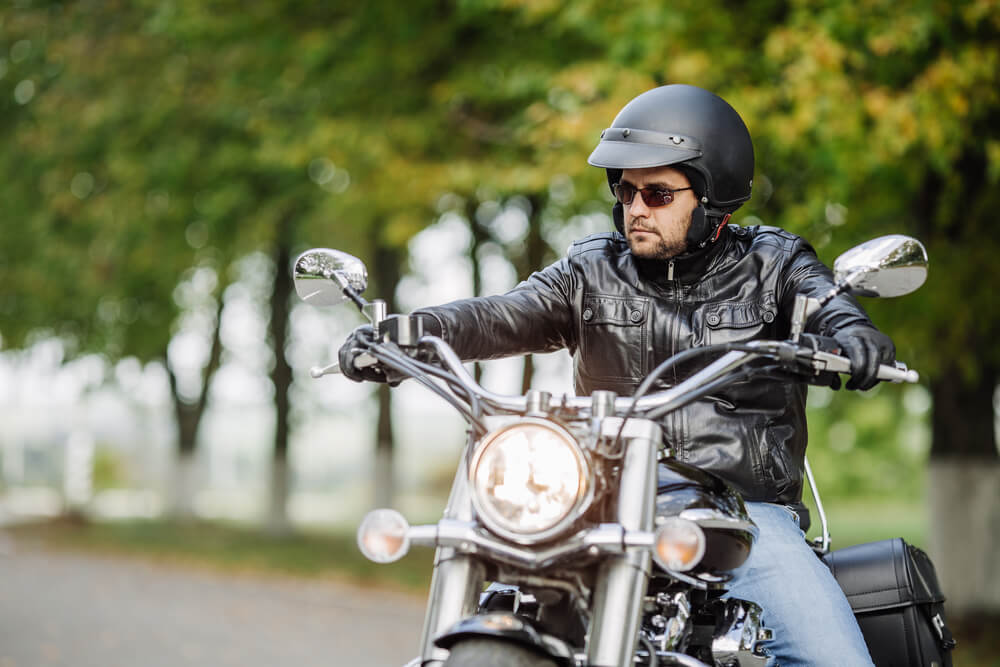 Rider wearing helmet for safety driving on his motorcycle.
