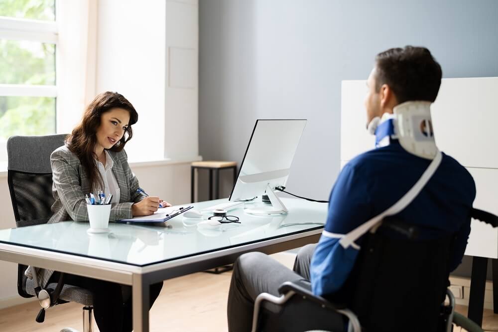 Injured worker in wheelchair applying for both ssd & workers compensation claim benefits.